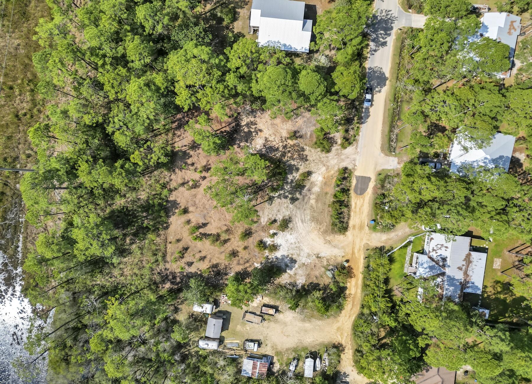 Lot 9 Starlight Lane Santa Rosa Beach, FL 32459 - Photo 6 of 9 an aerial view of residential house with outdoor space and trees all around