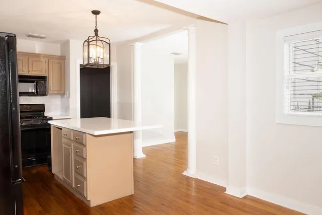 a kitchen with stainless steel appliances a refrigerator and a stove