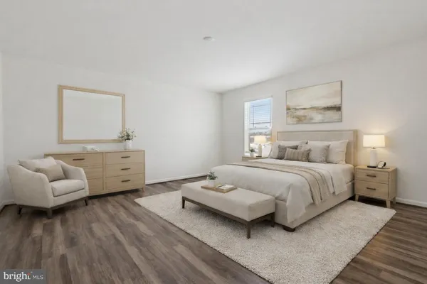 a bedroom with a bed and a couch