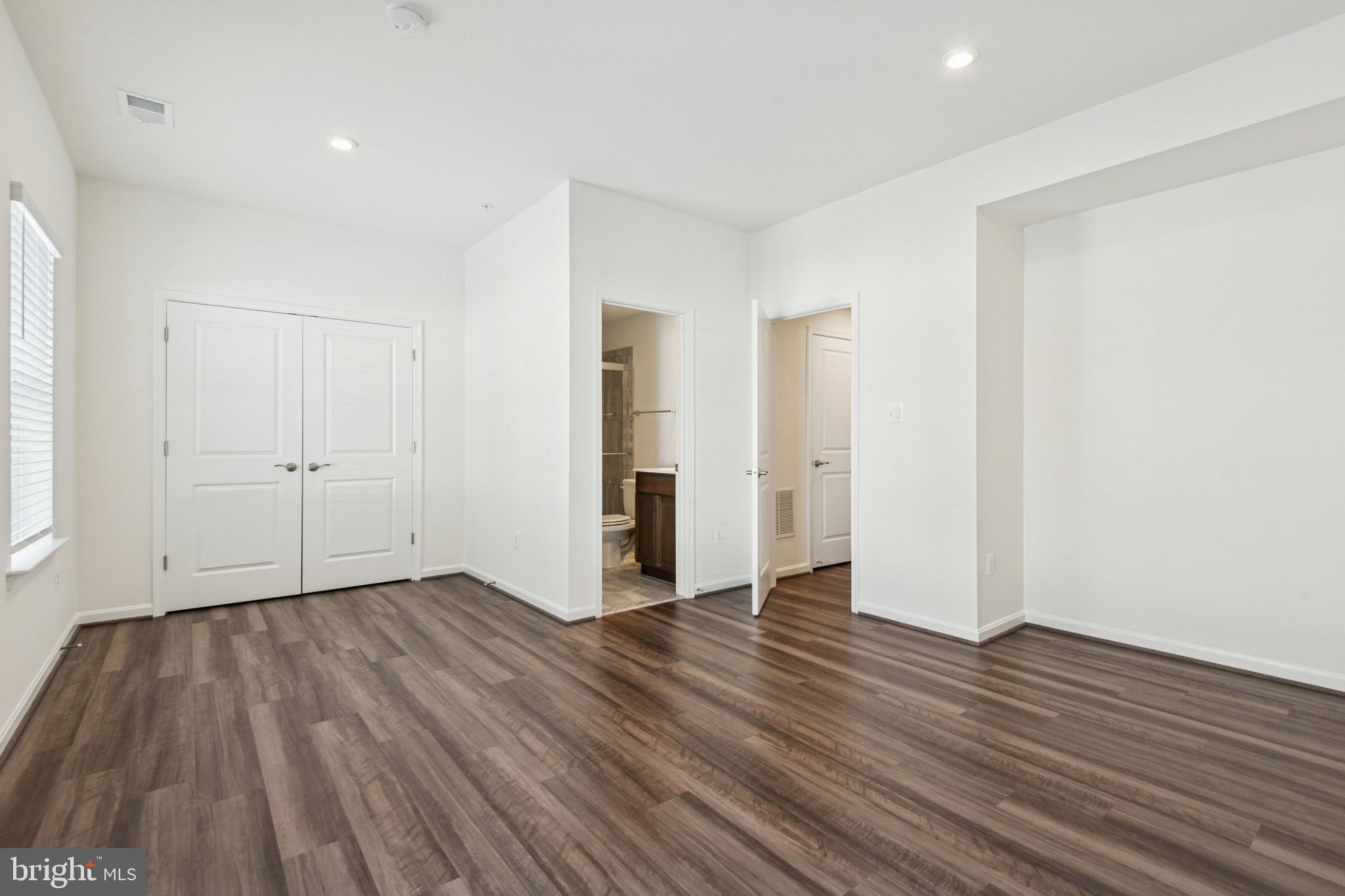 7831 Wolf Run Lane Severn, MD 21144 - Photo 29 of 30 an empty room with wooden floor