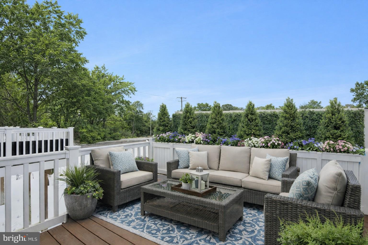 7831 Wolf Run Lane Severn, MD 21144 - Photo 7 of 30 a view of balcony with couches and potted plants