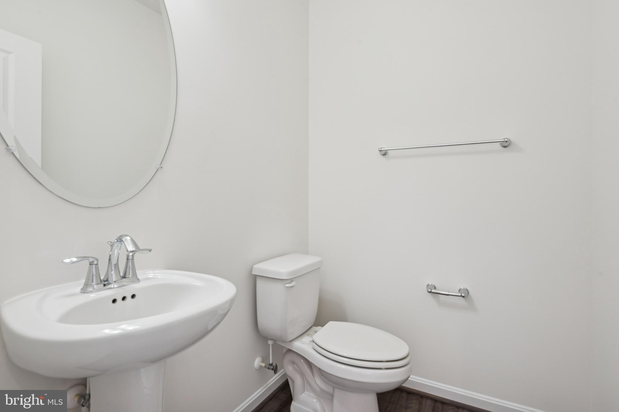 7831 Wolf Run Lane Severn, MD 21144 - Photo 10 of 30 a bathroom with a sink toilet and a mirror
