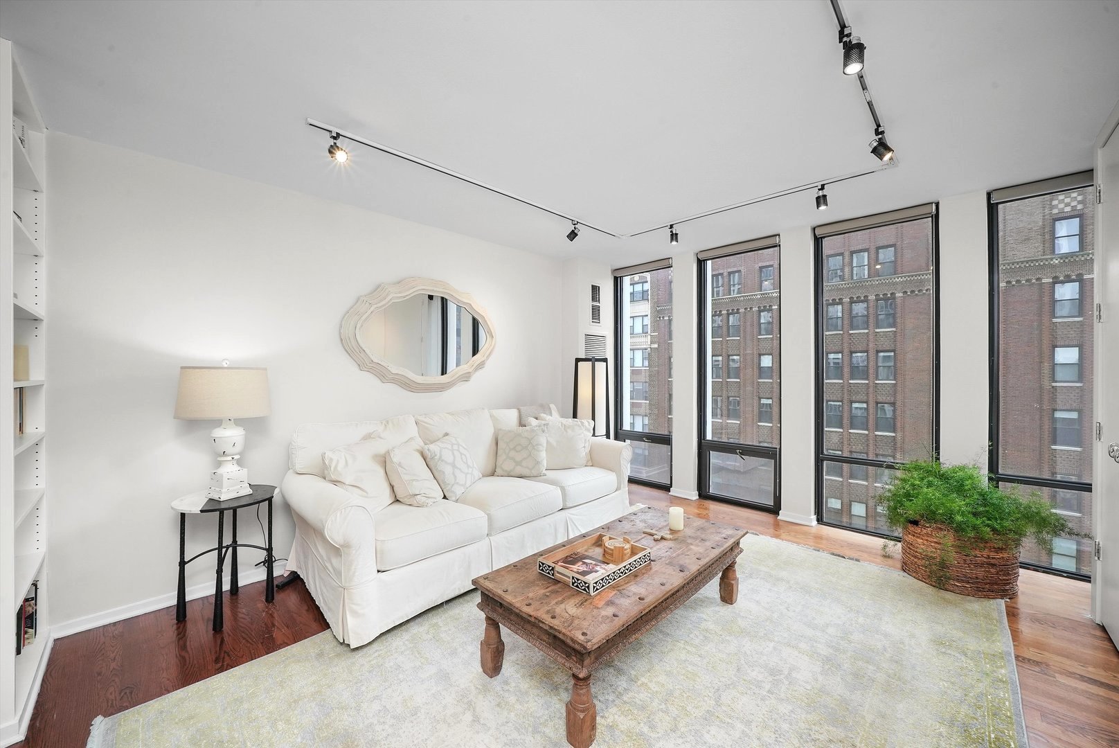 200 East Delaware Place, Unit 15F Chicago, IL 60611 - Photo 11 of 27 a living room with furniture and a large window
