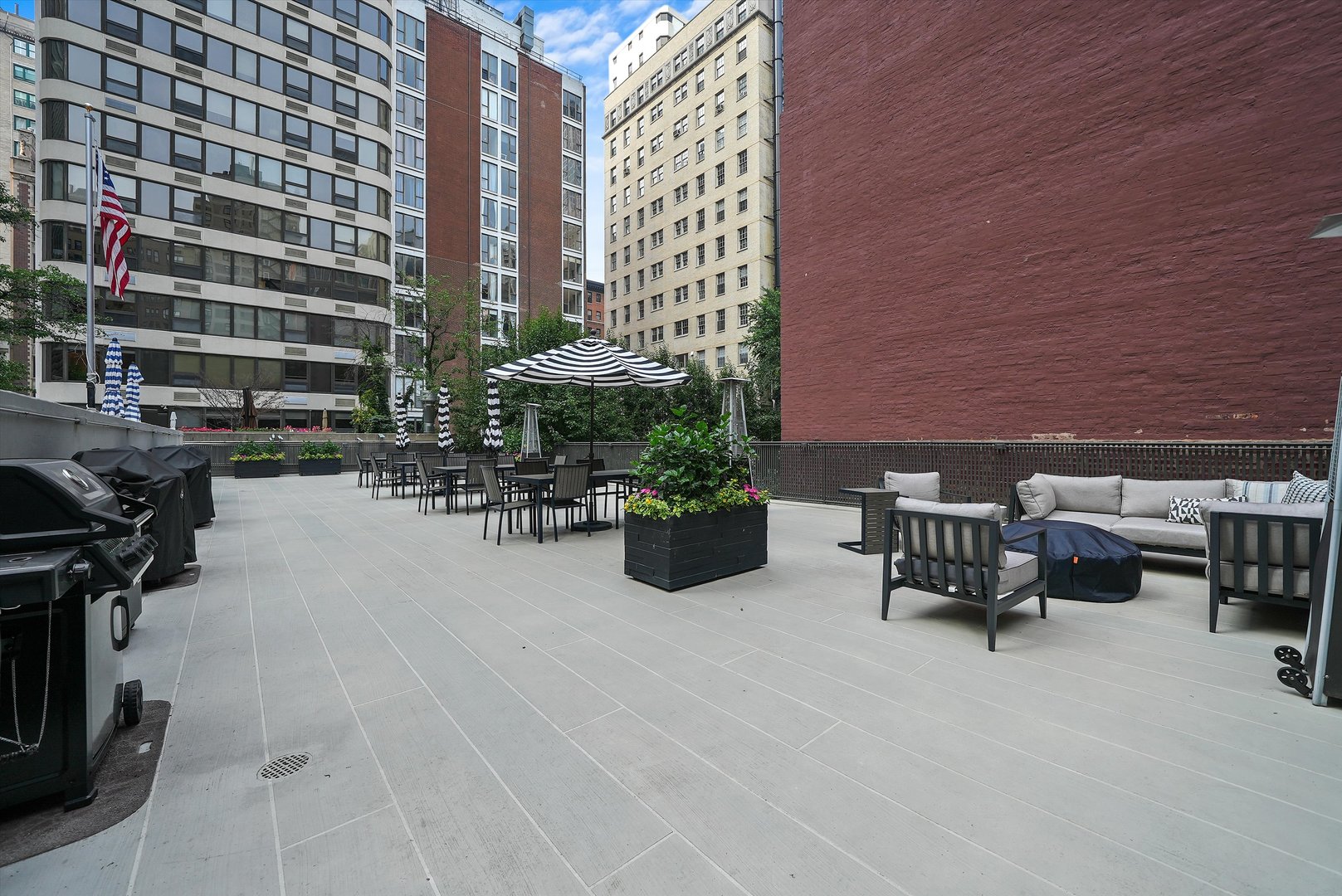 200 East Delaware Place, Unit 15F Chicago, IL 60611 - Photo 21 of 27 a view of a patio with a table and chairs