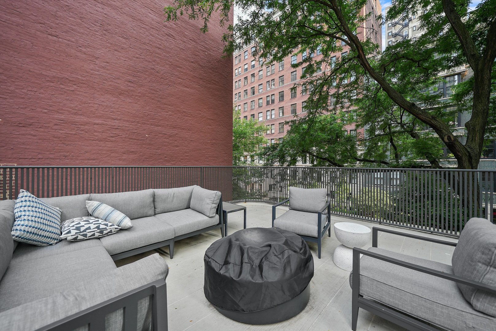 200 East Delaware Place, Unit 15F Chicago, IL 60611 - Photo 22 of 27 a view of a patio with couches and a potted plant on a table
