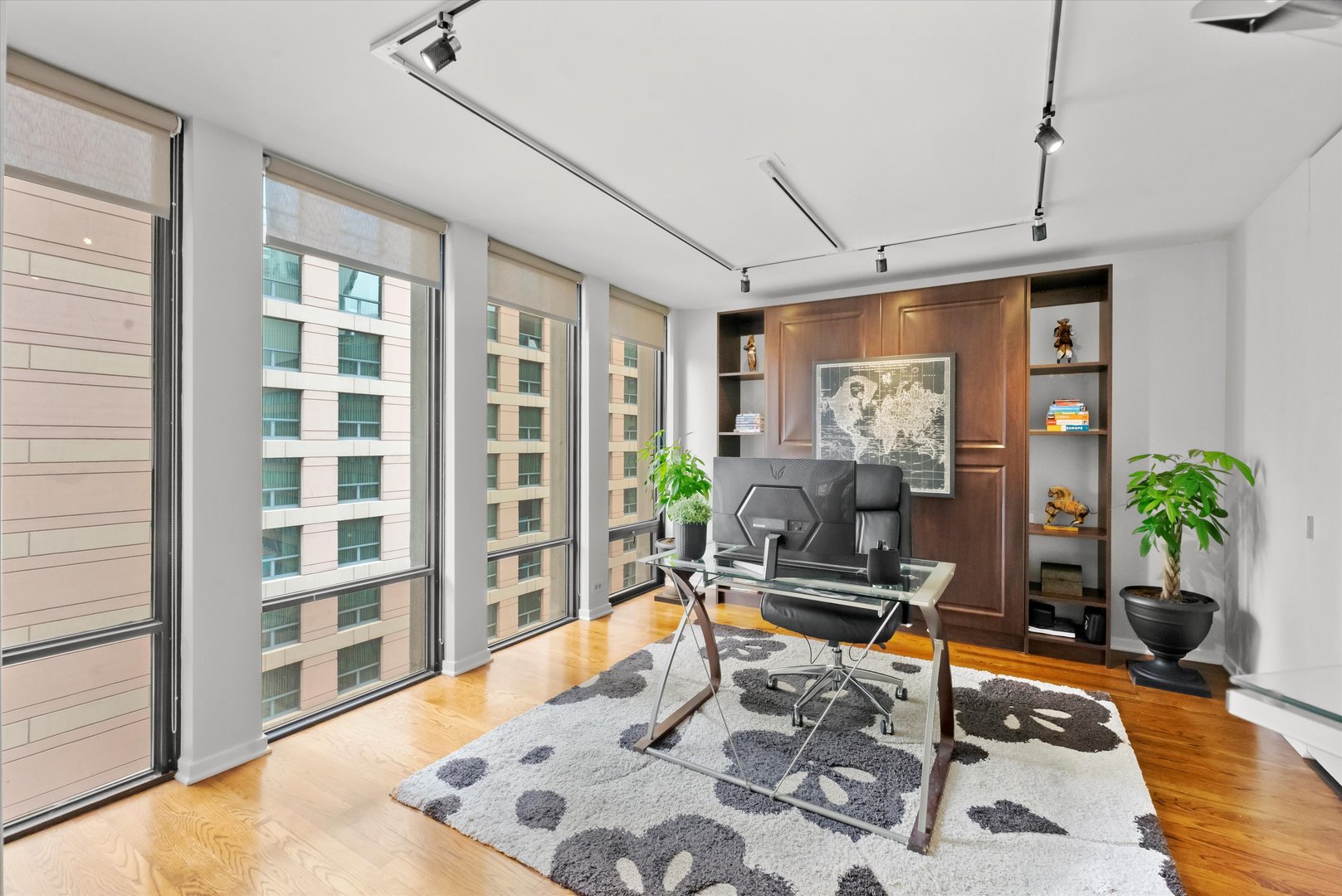 200 East Delaware Place, Unit 15F Chicago, IL 60611 - Photo 9 of 27 a living room with patio furniture and floor to ceiling window