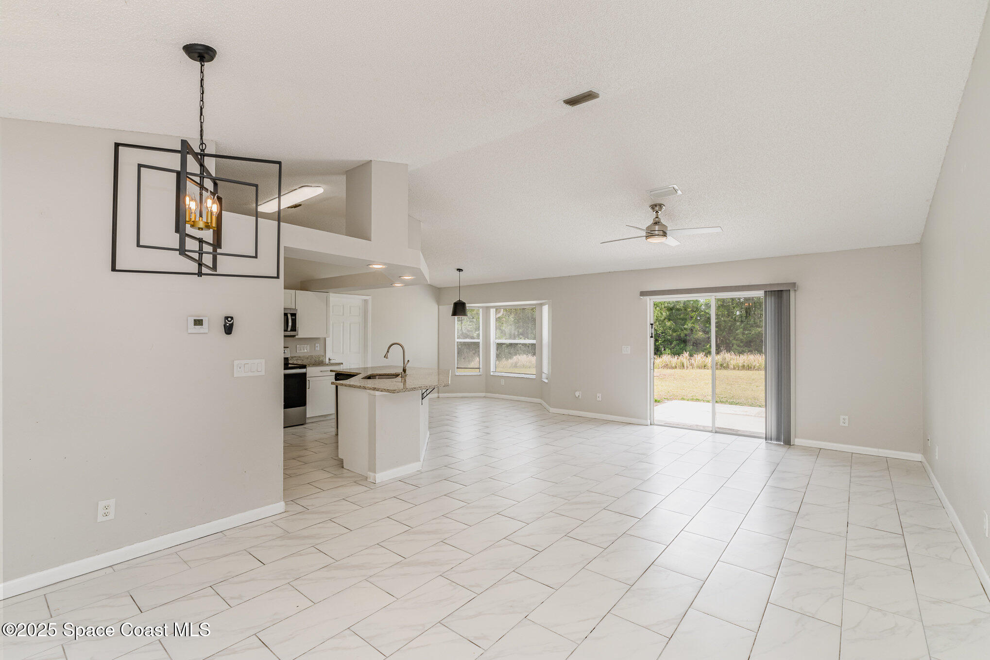 2208 Ravel Road Southeast Palm Bay, FL 32909 - Photo 9 of 27 010_file_518