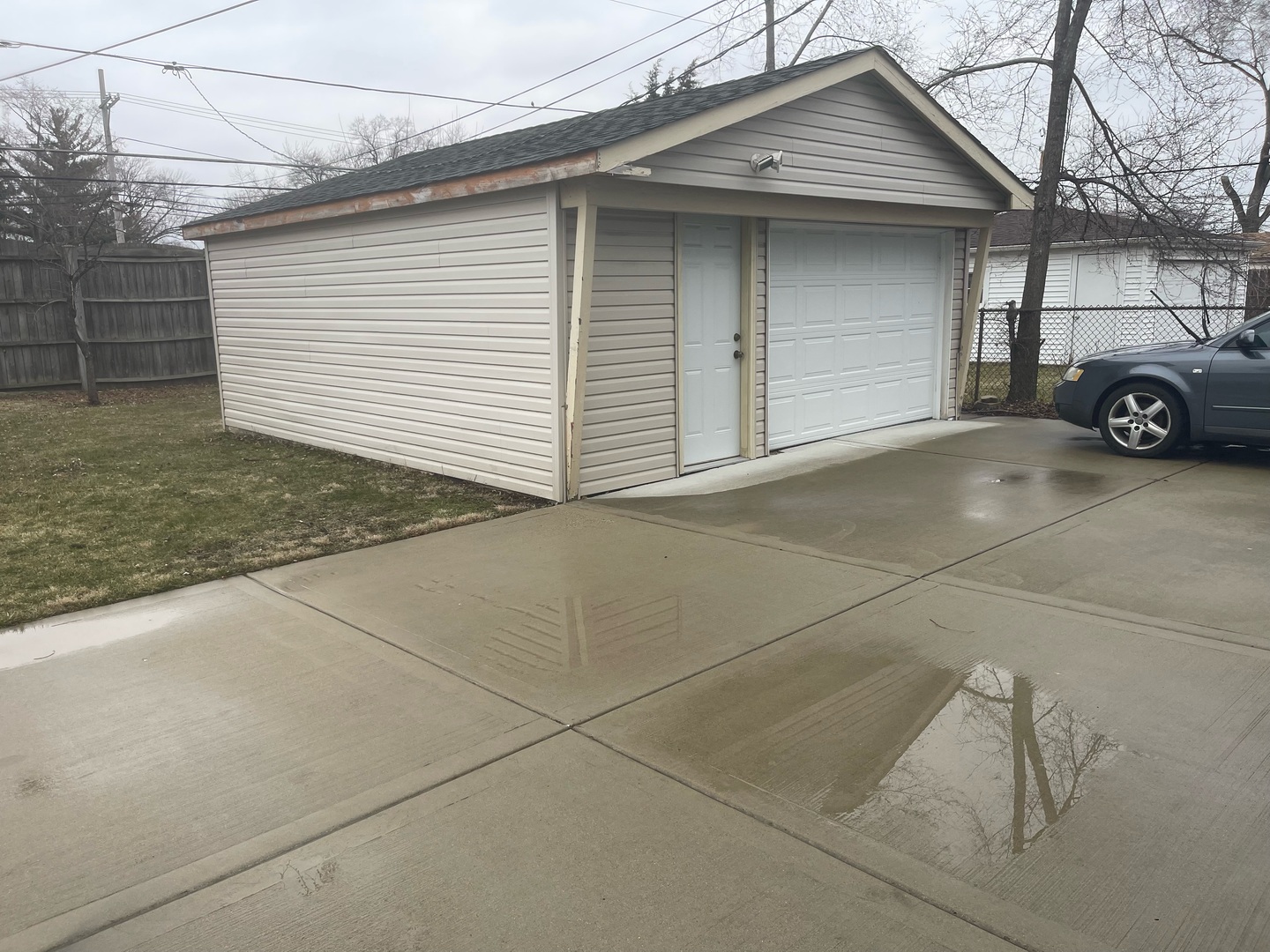 216 West Wayne Place Wheeling, IL 60090 - Photo 9 of 12 a car parked in front of white house