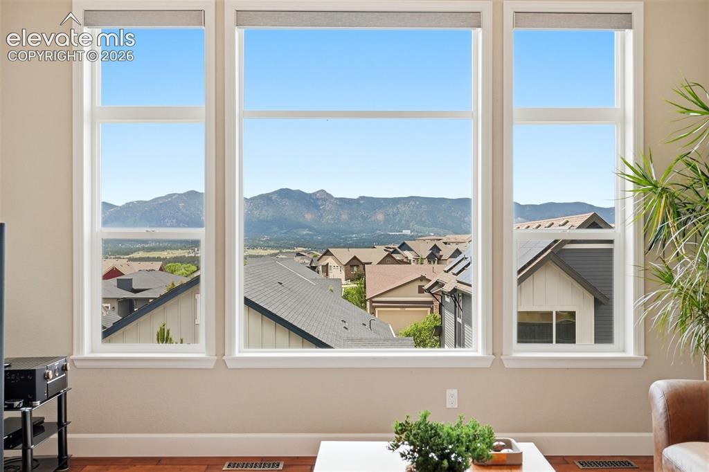 1394 Promontory Bluff View Colorado Springs, CO 80921 - Photo 16 of 47 a view of a balcony with a couple of potted plants