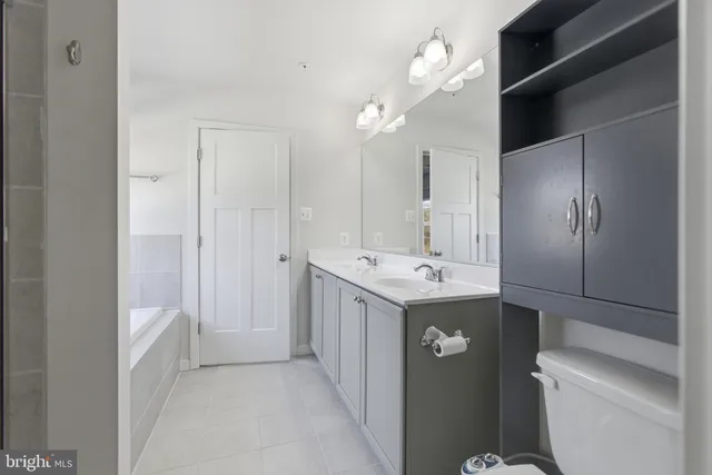 a view of bathroom with a sink a toilet and shower