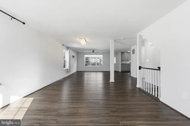 a view of an entryway with wooden floor