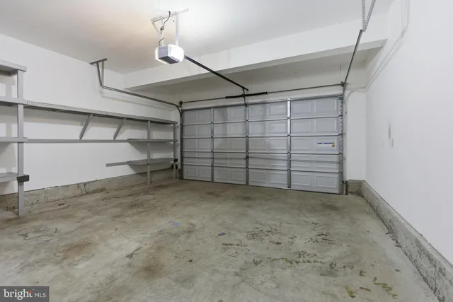 a view of an empty room with a fireplace