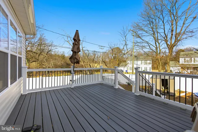 a view of a swimming pool with an outdoor seating