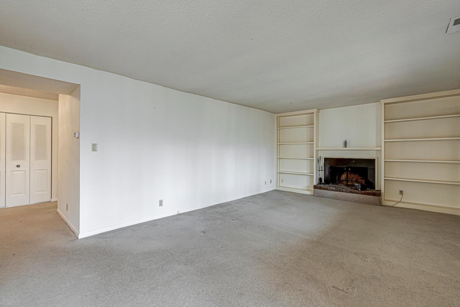 3086 Colony Road, Unit E Durham, NC 27705 - Photo 12 of 30 a view of empty room with a fireplace