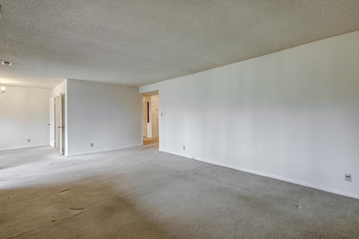 3086 Colony Road, Unit E Durham, NC 27705 - Photo 13 of 30 a view of an empty room and chandelier