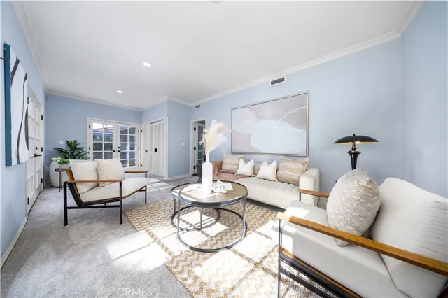 a living room with furniture and a table