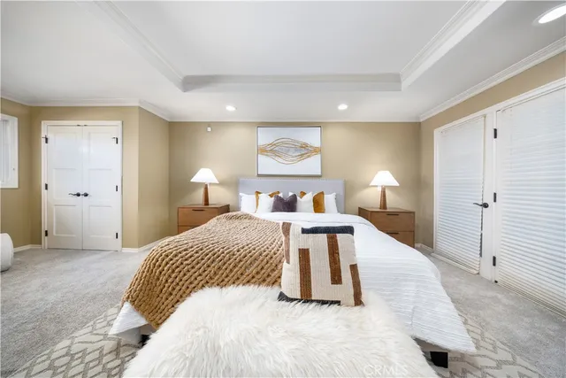 a bedroom with a bed and a night stand