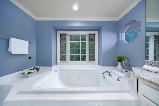 a bathroom with a bathtub and sink