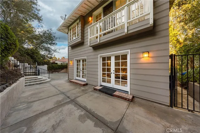 a view of a house with a street