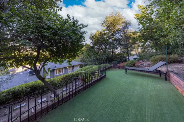a view of a backyard with potted plants
