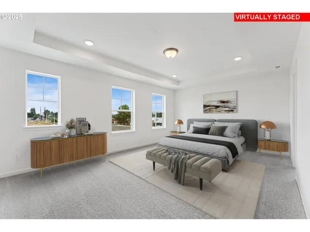 a living room with a bed furniture and a window