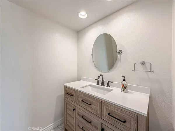 a utility room with sink dryer and washer