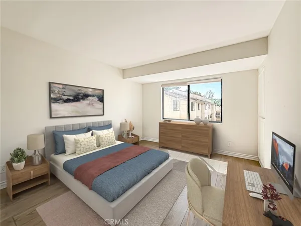 a view of a white house with a large tree