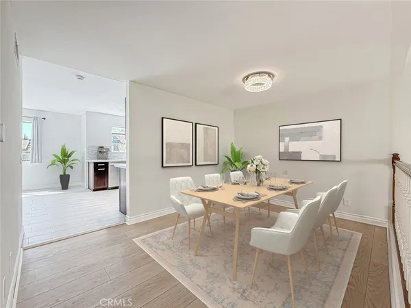 a large kitchen with a large window and stainless steel appliances