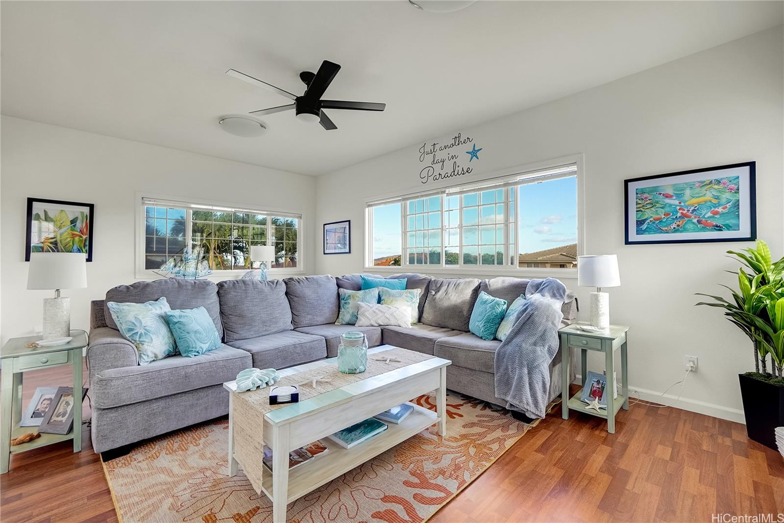 92-1306 Hauone Street Kapolei, HI 96707 - Photo 11 of 25 a living room with furniture and a large window