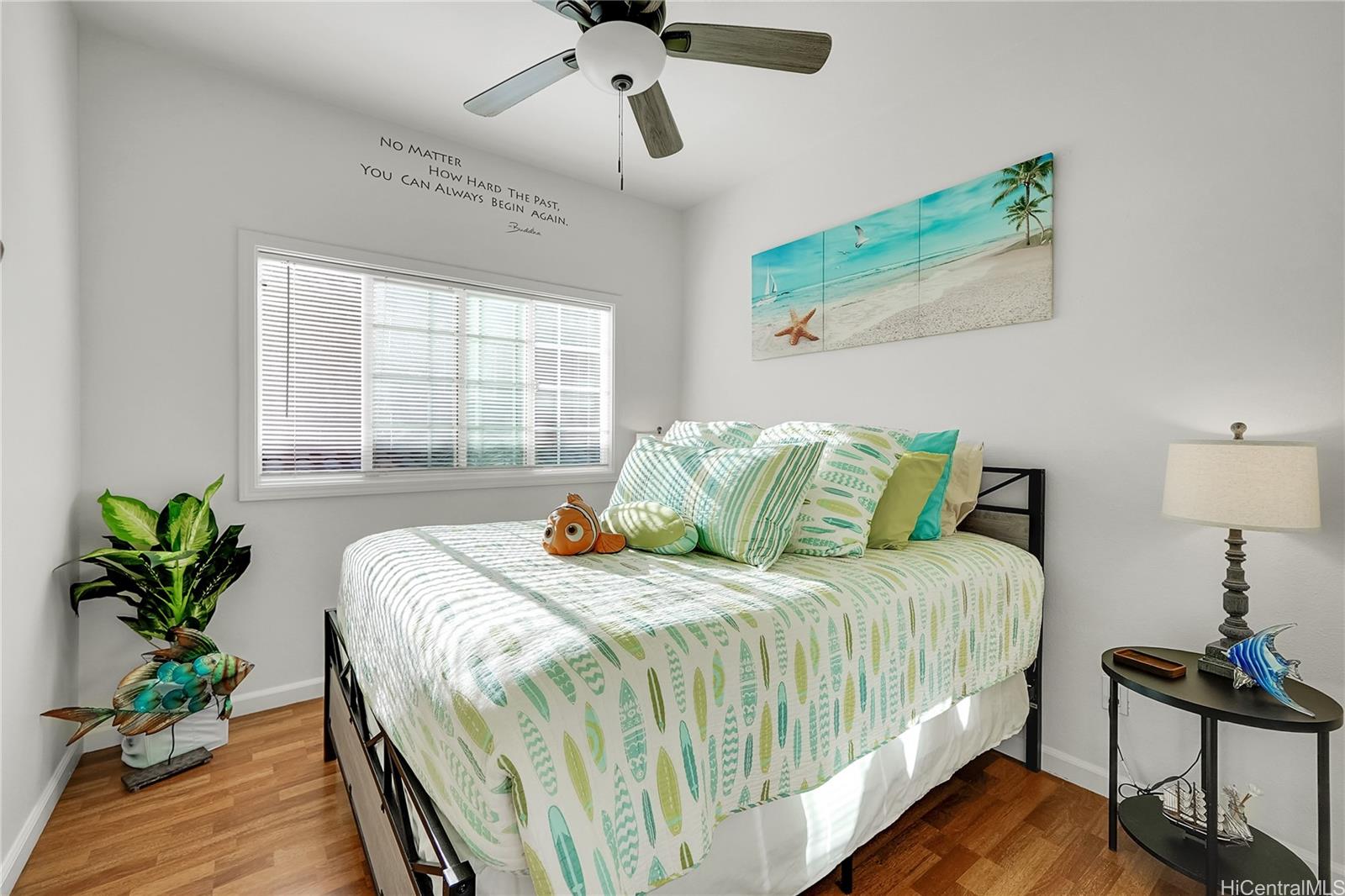 92-1306 Hauone Street Kapolei, HI 96707 - Photo 18 of 25 a bedroom with a bed and a potted plant