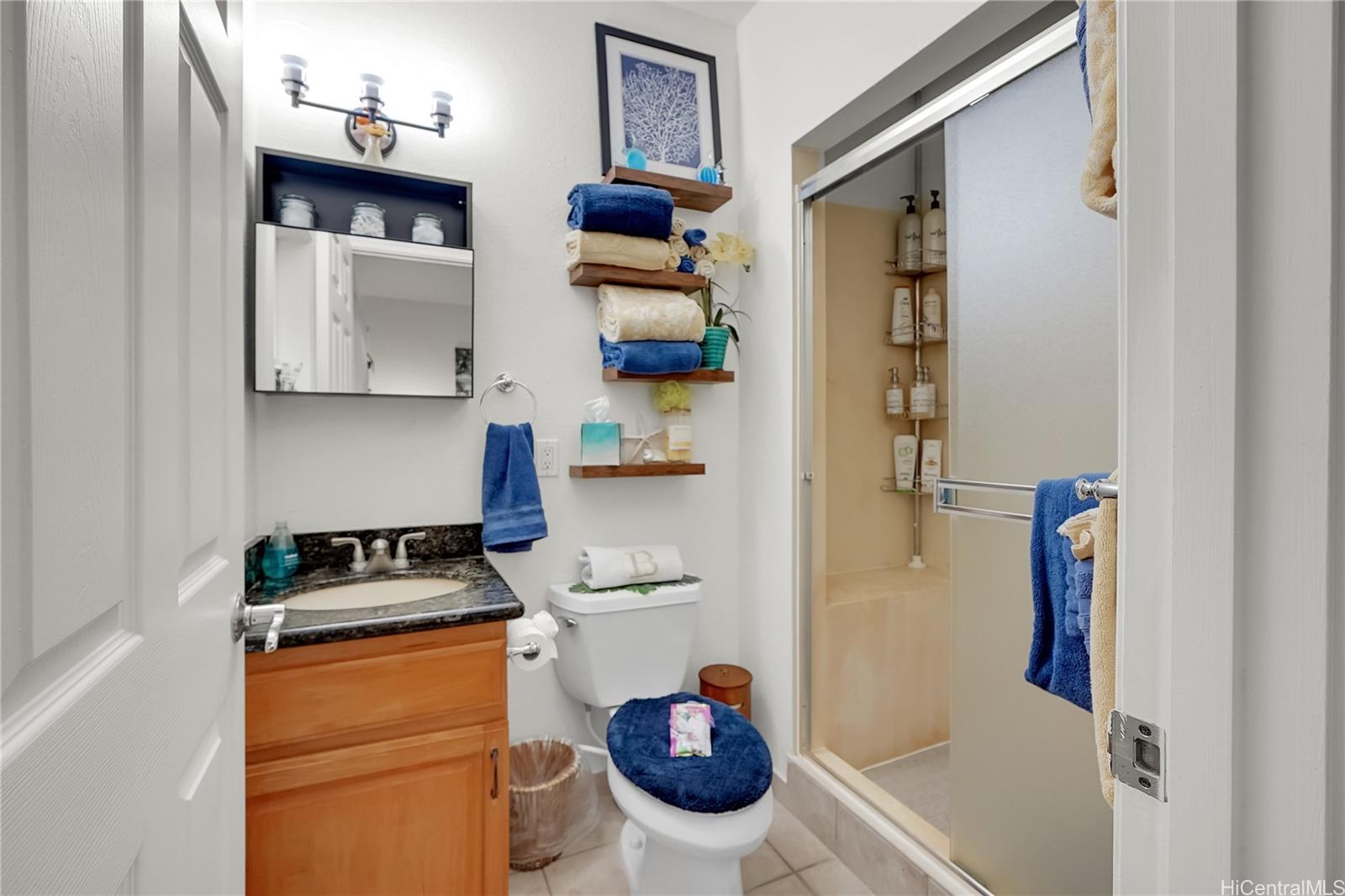 92-1306 Hauone Street Kapolei, HI 96707 - Photo 19 of 25 a kitchen with a refrigerator and a stove