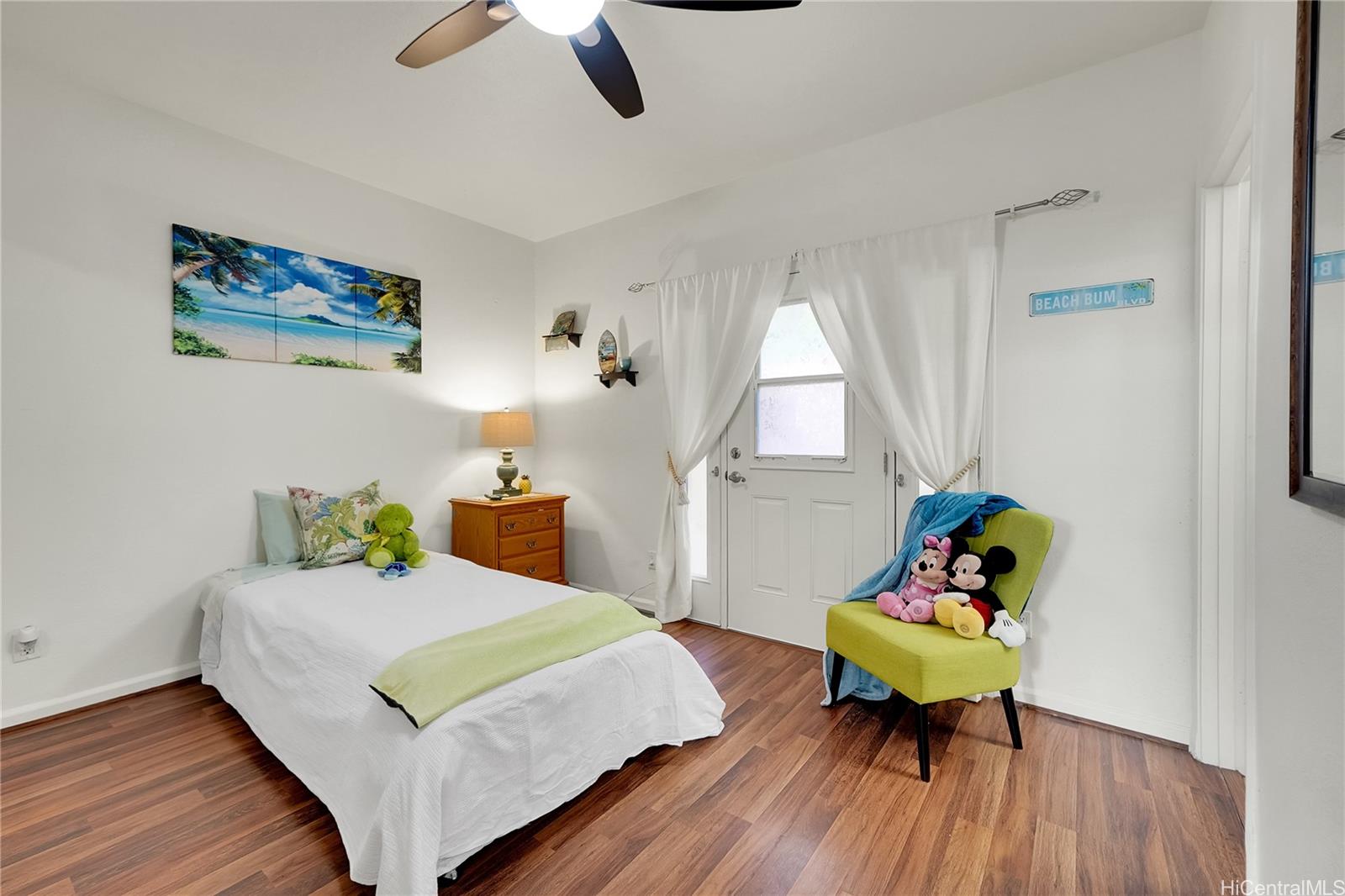 92-1306 Hauone Street Kapolei, HI 96707 - Photo 20 of 25 a bedroom with a bed and a table