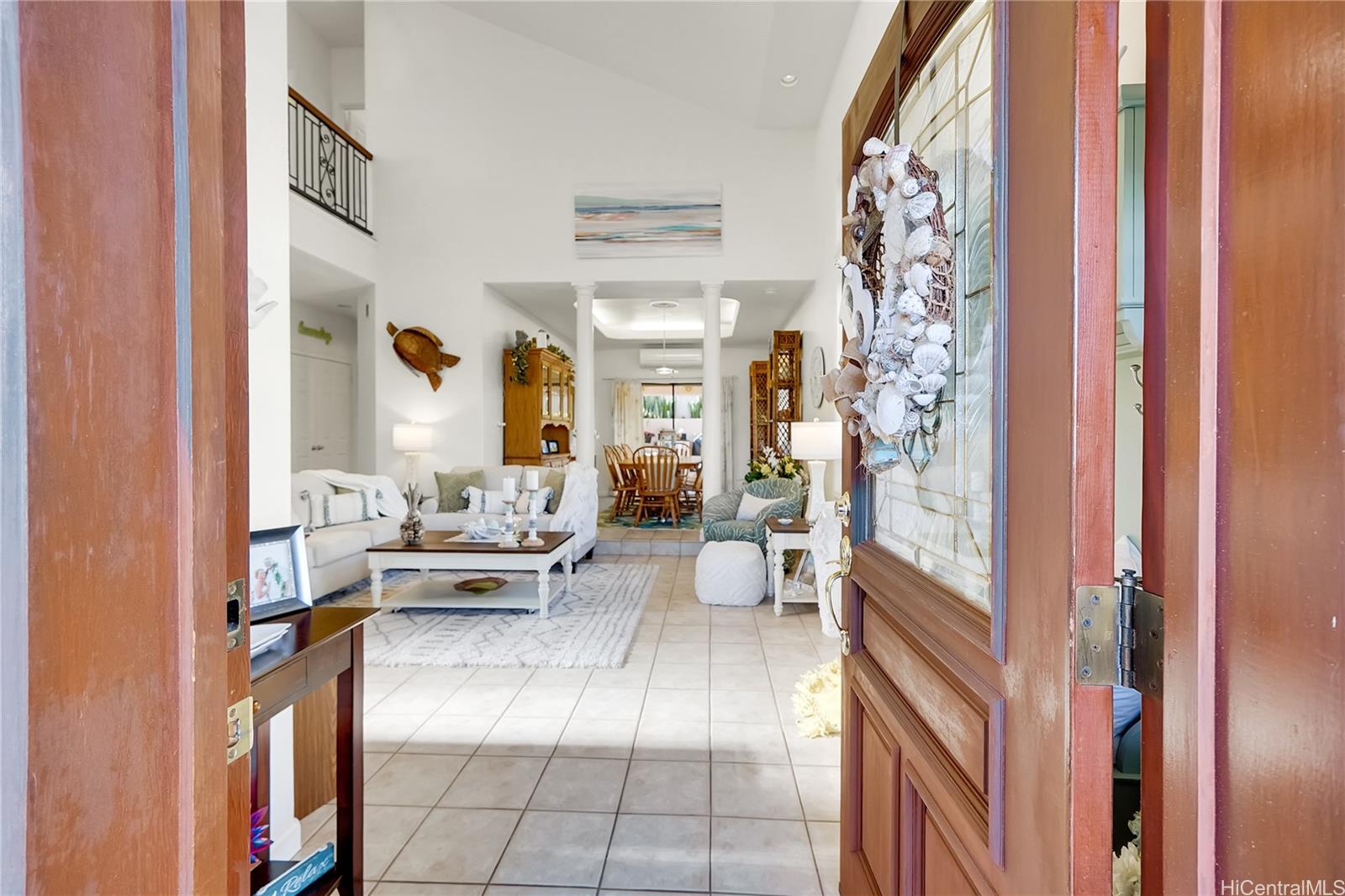 92-1306 Hauone Street Kapolei, HI 96707 - Photo 2 of 25 a living room with furniture and a large window