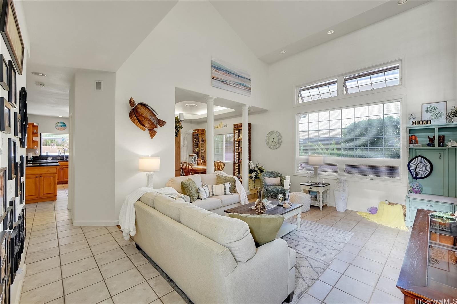 92-1306 Hauone Street Kapolei, HI 96707 - Photo 5 of 25 a living room with fireplace furniture and a large window