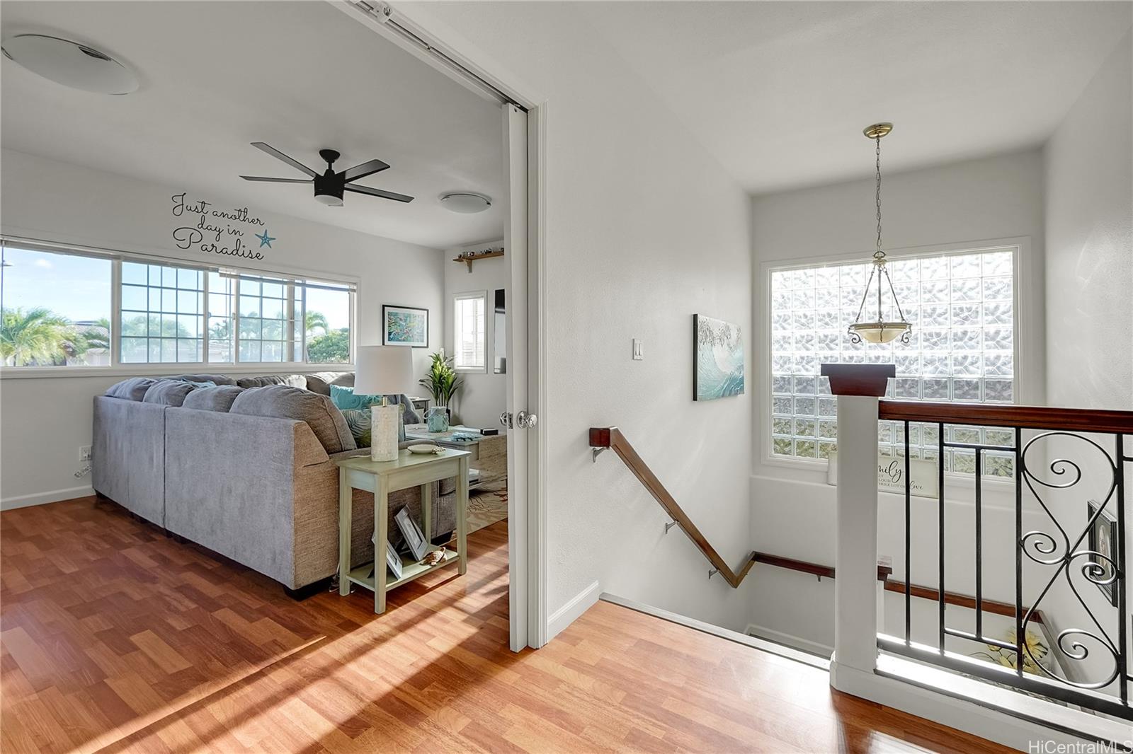 92-1306 Hauone Street Kapolei, HI 96707 - Photo 10 of 25 a living room with furniture tv and a large window