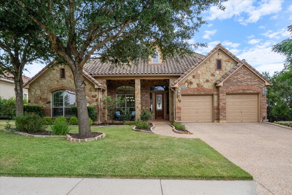 3920 Vail Divide Bee Cave, TX 78738 - Photo 1 of 34 front view of a house with a yard