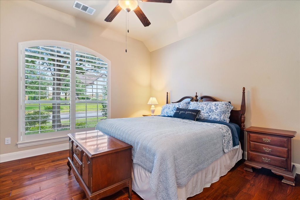 3920 Vail Divide Bee Cave, TX 78738 - Photo 19 of 34 a bed room with a bed and a chair