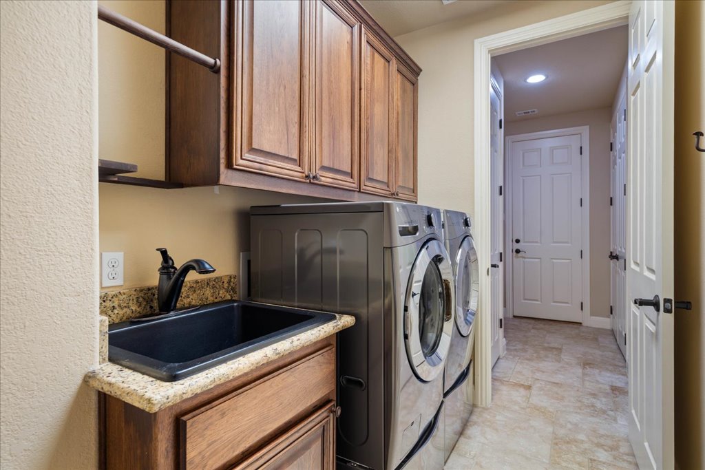 3920 Vail Divide Bee Cave, TX 78738 - Photo 27 of 34 a utility room with dryer and washer
