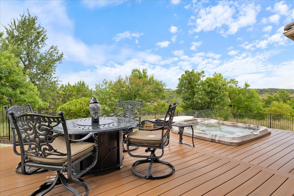 3920 Vail Divide Bee Cave, TX 78738 - Photo 30 of 34 a view of a chairs and table on the wooden floor