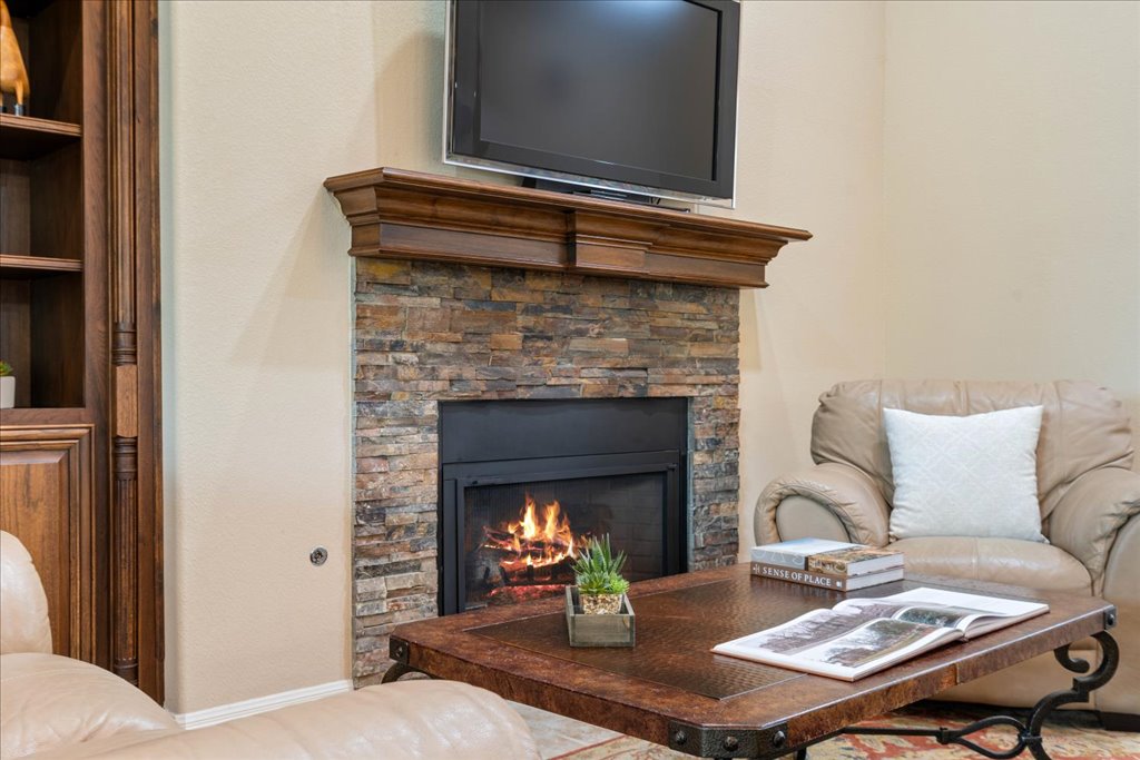 3920 Vail Divide Bee Cave, TX 78738 - Photo 7 of 34 a living room with furniture and a fireplace