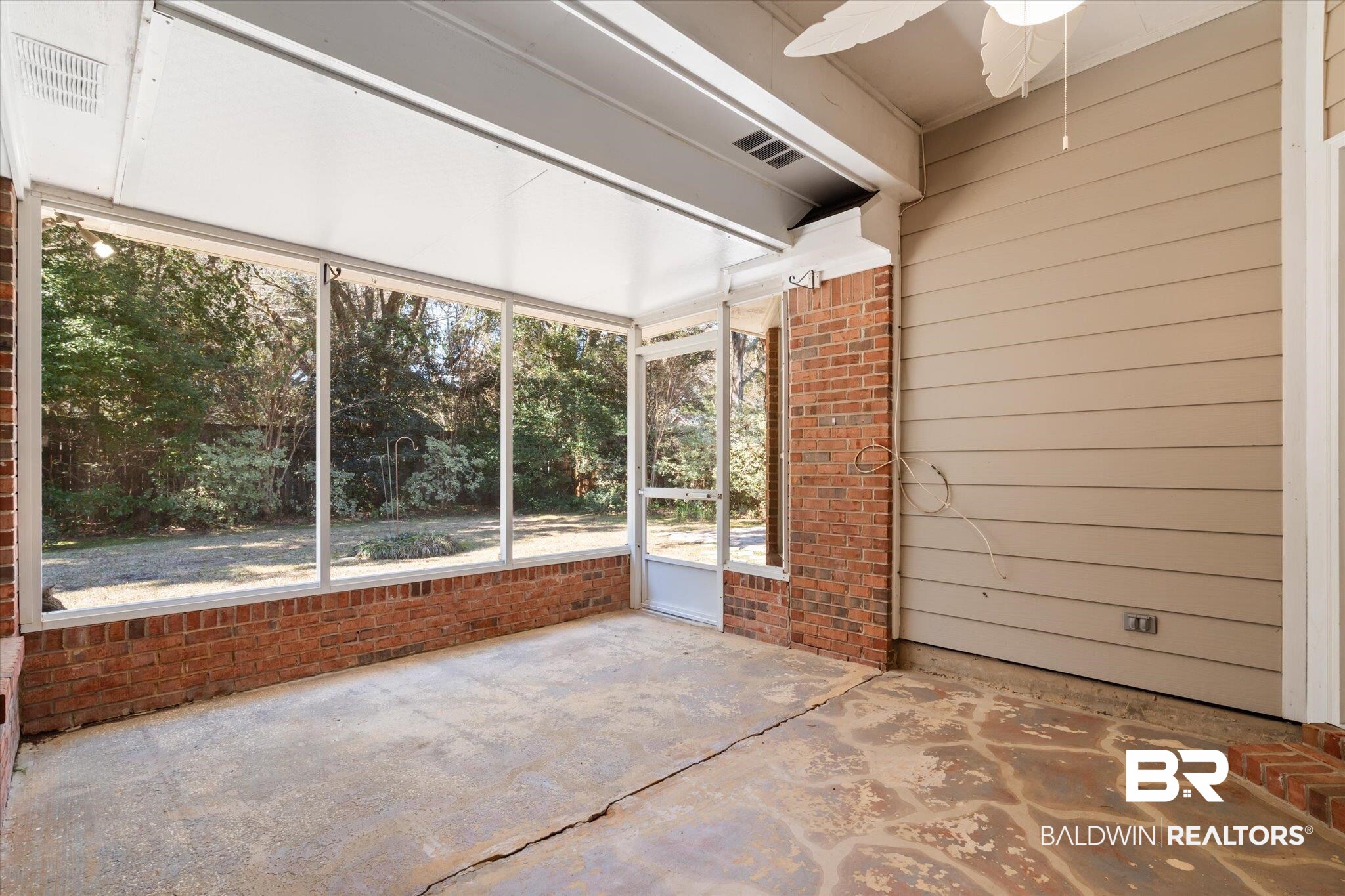 2220 Irongate Court Mobile, AL 36695 - Photo 18 of 20 Unfurnished sunroom with ceiling fan and visible vents