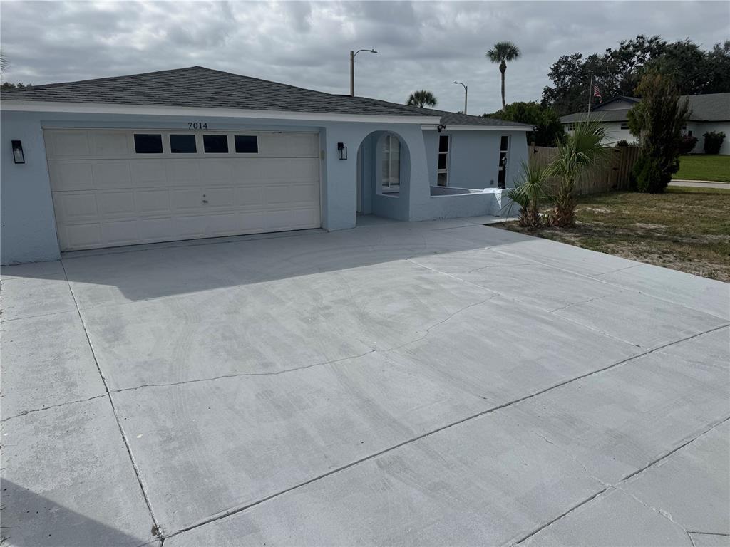 7014 Ingleside Drive Port Richey, FL 34668 - Photo 1 of 1 a view of a house with a garage