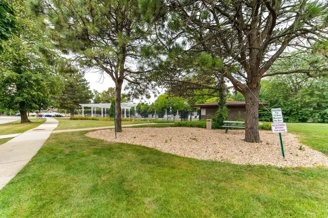 a view of a swimming pool with sitting area