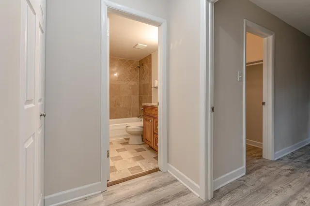 a view of a bathroom from a hallway
