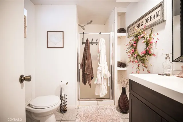 a swimming pool with outdoor seating and a garden