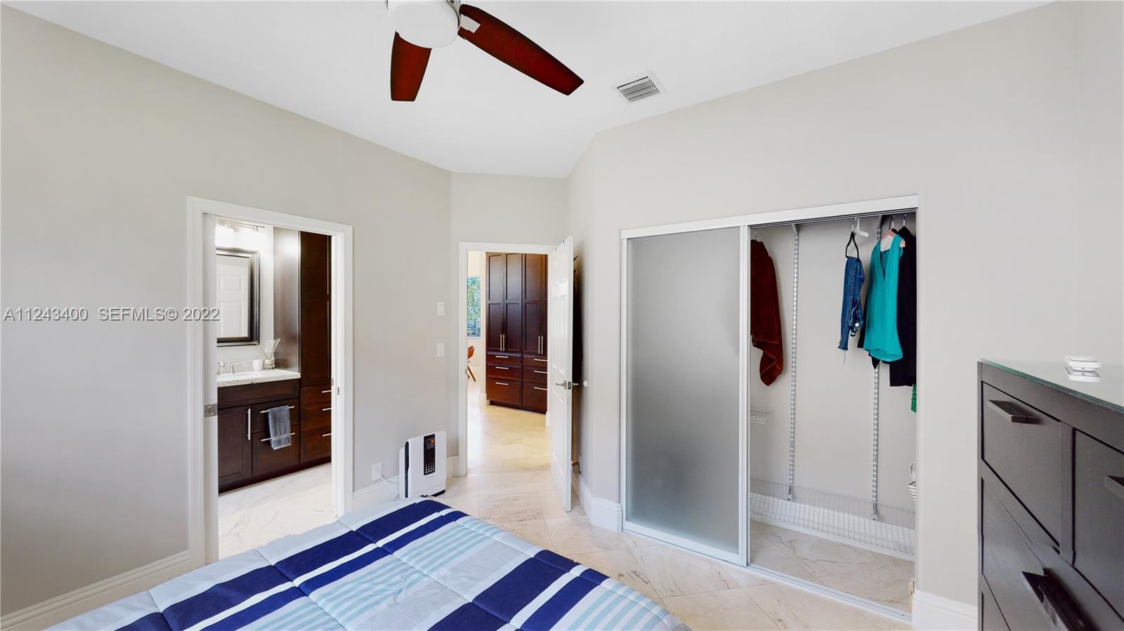 1136 Ginger Circle Weston, FL 33326 - Photo 14 of 32 a hallway with wooden floor and windows