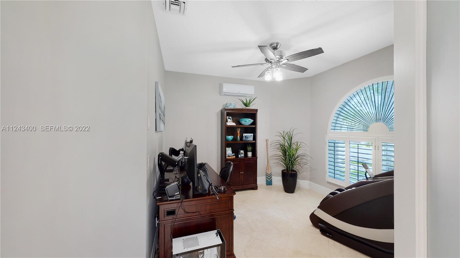 1136 Ginger Circle Weston, FL 33326 - Photo 17 of 32 a living room with furniture and a window
