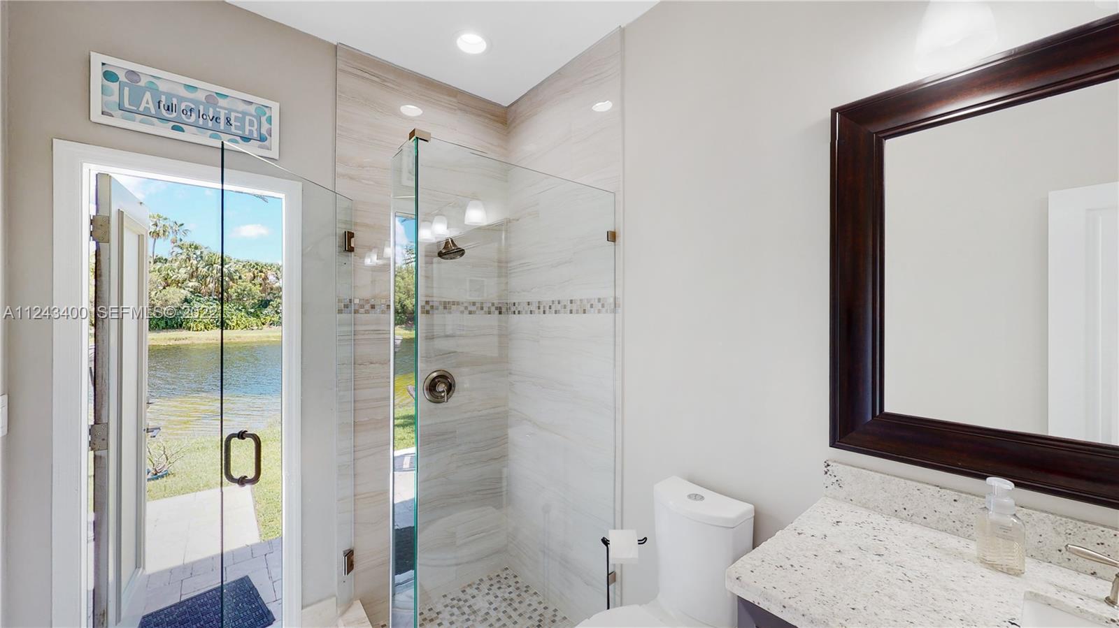 1136 Ginger Circle Weston, FL 33326 - Photo 20 of 32 a bathroom with a bathtub shower sink and toilet