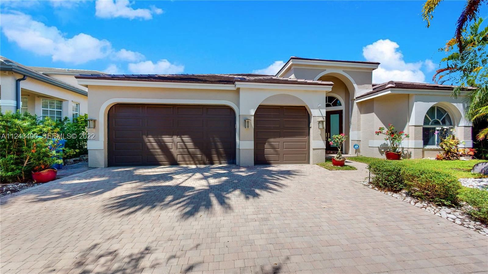 1136 Ginger Circle Weston, FL 33326 - Photo 2 of 32 a front view of house with yard