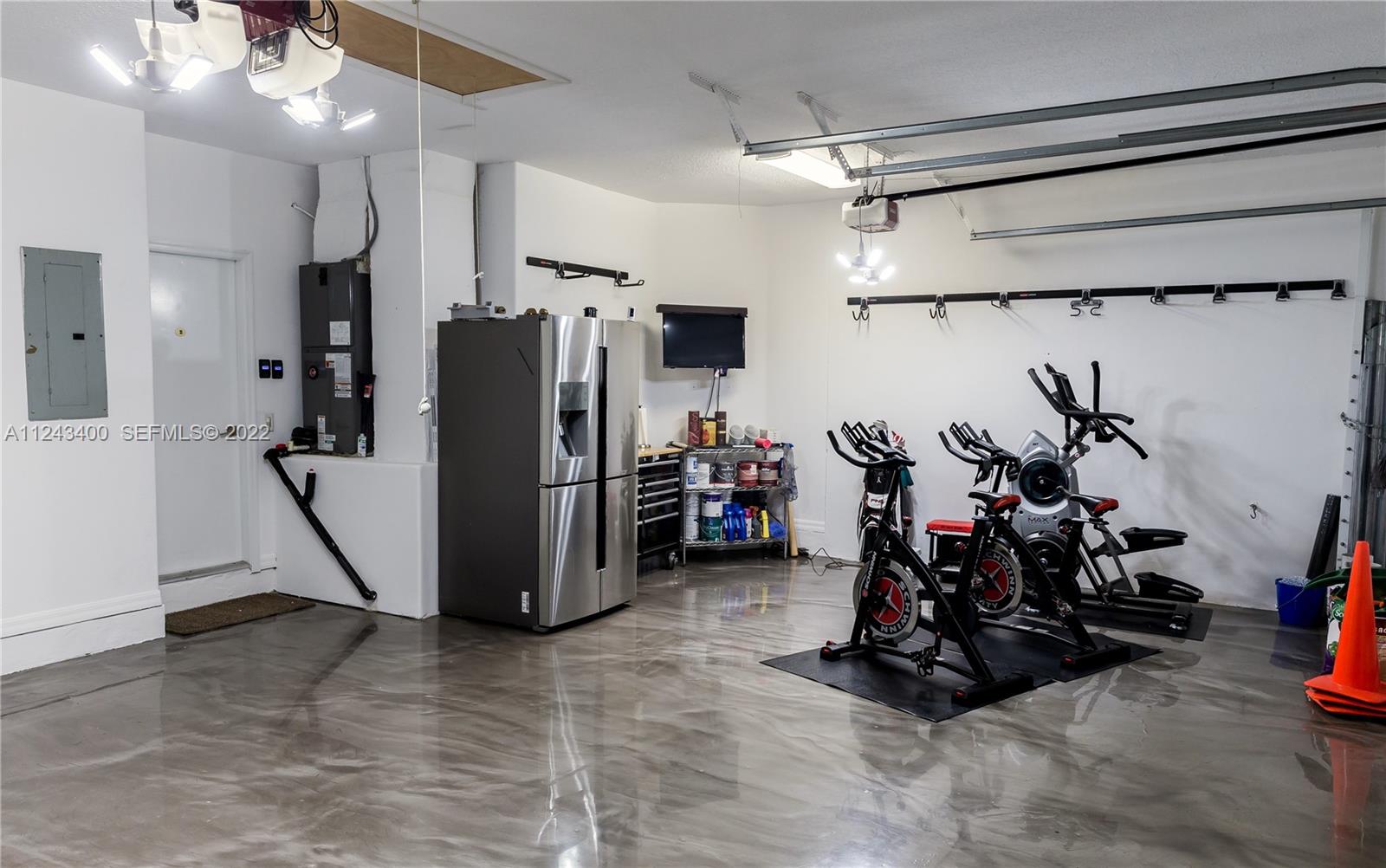 1136 Ginger Circle Weston, FL 33326 - Photo 23 of 32 a view of a room with gym equipment